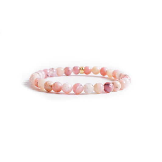 Elegant pink opal armband named Auge der Götter, showcasing smooth, colorful beads on a simple design.